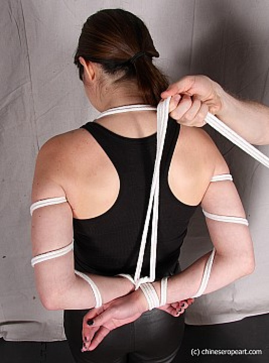 girl with hands tied